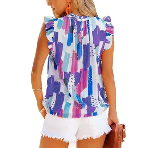 Detail view of the back showing colorful abstract print sleeveless top and ruffle details.
