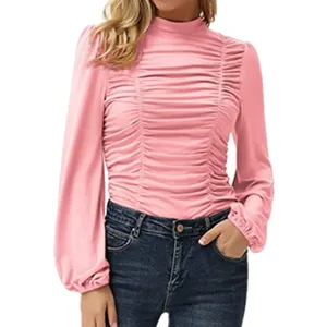 Close-up detail of the pink mock neck ruched slim-fit long sleeve top with lantern sleeves.