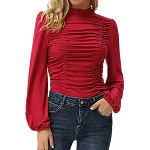 Detail shot of women red mock neck ruched long sleeve top with stylish lantern sleeves.