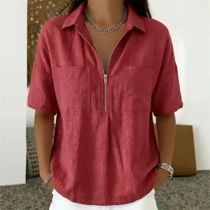 Detail shot of women's short sleeve lapel V-neck zipper shirt showing texture and chest pockets.