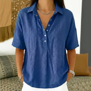 Close-up detail of blue loose short-sleeve lapel shirt showcasing soft fabric and buttons.