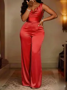 Detail view of the elegant red satin sleeveless cowl neck wide leg jumpsuit, stunning drape.