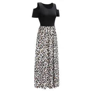 Cold shoulder color block dress detail showing black top and leopard print long skirt.