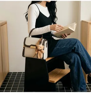 Retro contrast color women top handle bag with cute bear pendant for daily commute stylish.