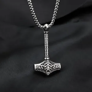 Detailed shot of stainless steel Thor hammer pendant with Viking Nordic knotwork design.