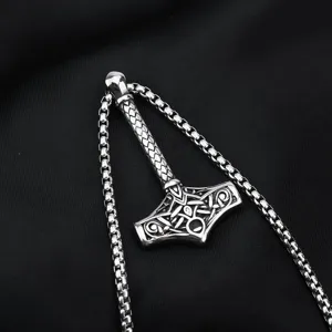 Stainless steel vintage Viking Thor hammer pendant detail, close-up necklace accessory.