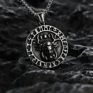 Close-up of vintage stainless steel Viking rune pendant with mystical horned god design.