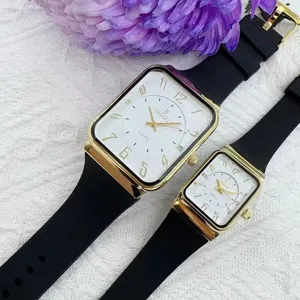 Orologio di coppia quadrato con cassa dorata e cinturino in silicone nero, chic.