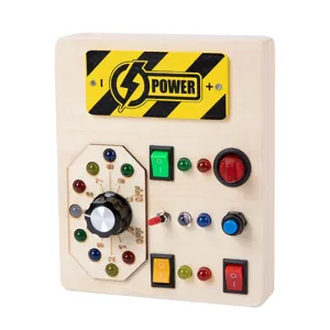Wooden Montessori sensory busy board with light switches, LED lights and interactive buttons.