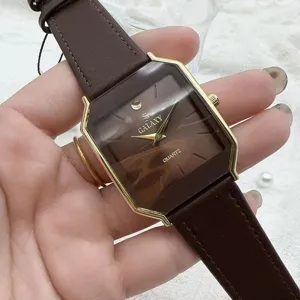 Vintage style men's quartz watch with brown leather strap and gold geometric case.