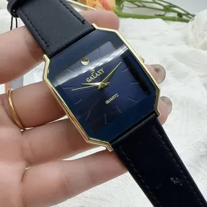 Close-up detail of vintage style men quartz watch with blue dial and black leather strap.