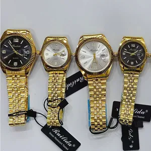 Montres à quartz dorées RUILIDA avec bracelet en métal, détail de montre de couple décontractée.