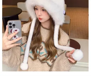 Sweet winter plush faux fur earflap hat with fluffy pom poms, warm and stylish for women.