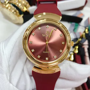 Women quartz watch with red silicone strap, gold case and rhinestone dial for daily wear.