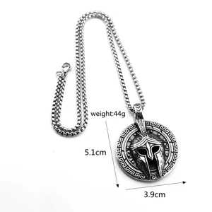Detailed close-up of stainless steel Spartan helmet pendant necklace with dimension specs.