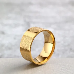 Stainless steel wide band ring with St Benedict cross exorcist medal design, golden finish.