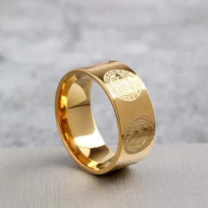 Stainless steel Saint Benedict cross exorcist ring, detailed view of religious engraved band.