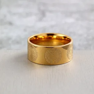 Detail shot of the stainless steel gold ring featuring intricate St. Benedict cross engravings.