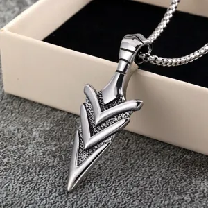 Close-up detail of retro stainless steel 3D arrowhead pendant necklace, unisex fashion jewelry.