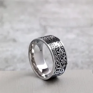 Vintage stainless steel wide ring featuring intricate tree of life and celtic knot engravings.