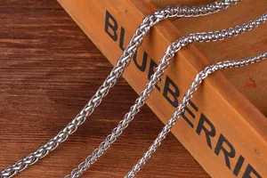 Stainless steel wheat chain necklace detail, durable titanium steel jewelry.