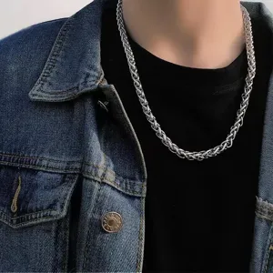 Stainless steel dragon bone chain necklace detail view, classic braided metal design.