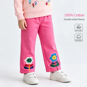 Detailed view of kids pink straight trousers featuring cute flower embroidery. Soft cotton.