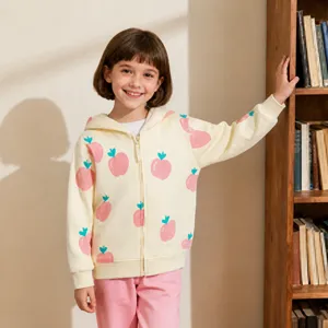 Close-up of the cream zip-up hoodie featuring cute pink apple print and cozy kids outfit detail.