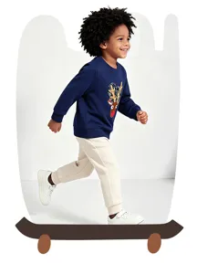 Close-up detail view of a toddler wearing a cozy navy blue Christmas reindeer sweatshirt.
