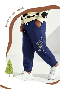 Kids Halloween spider web print sweatpants detail, cozy fabric, elastic cuffs for boys.