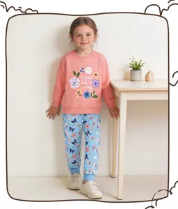 Girls cute floral sweatshirt and butterfly print cuffed joggers set detail view, casual autumn wear.