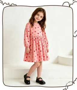 Girls long sleeve princess dress featuring a cute pink heart print design, perfect for autumn wear.