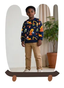 Boys navy blue sweatshirt featuring fun cartoon construction trucks print, paired with khaki trousers.