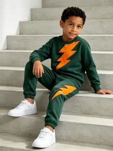 Kids dark green tracksuit set featuring bold orange lightning print sweatshirt and matching sweatpants.