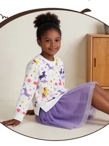 Cute toddler girls long sleeve sweatshirt and purple mesh skirt outfit detail shot.