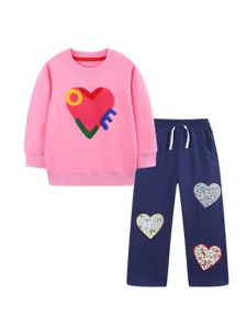 Kids pink sweatshirt and dark blue sweatpants clothing set featuring cute heart patches.