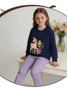 Detail view of a cute girls navy blue sweatshirt featuring a sweet unicorn print and purple pants.