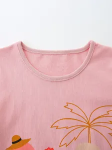 Kids short sleeve t-shirt summer pink knit cotton top with cute tropical palm tree graphic.