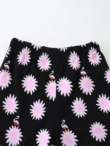 Summer children shorts knit cotton waistband close up view with cute pink floral print.