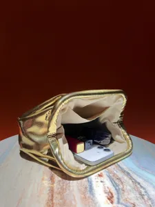 Shiny metallic gold clutch bag for women, elegant evening party handbag with frame closure.