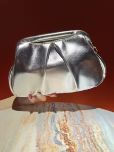 Shiny silver pleated clutch bag for women, stylish metallic evening bag and party handbag.
