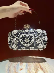 Elegante schwarze Abendtasche mit funkelnden Strasssteinen und Perlen für besondere Anlässe.