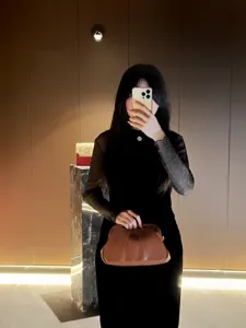 Brown pleated leather clutch bag for women, elegant evening party handbag with stylish design.