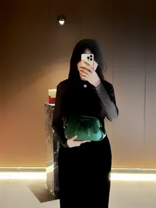Green gathered leather clutch bag, stylish pleated evening handbag for women daily use.
