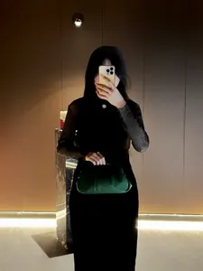 Chic glossy pleated evening clutch bag for women, elegant green shoulder handbag.