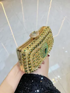 Luxury gold rhinestone evening clutch bag with sparkling green crystals for elegant parties.