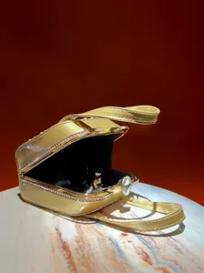 Exquisite rhinestone evening handbag with gold finish, elegant structured clutch for women.