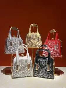 Detailed view of luxury rhinestone pearl evening handbags, showcasing exquisite hardware.