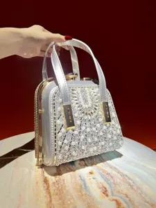 Exquisite silver rhinestone evening handbag featuring pearl details for stylish women.