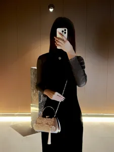 Chinese style evening handbag with floral decor and metal handle for women elegant dress outfit.